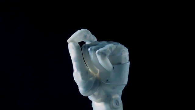 详情图-一个白色的假体可以弯曲手指。