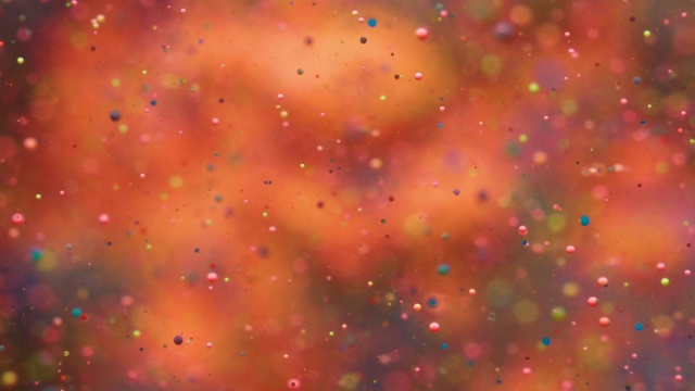 彩色气泡油美丽的油漆多色的宇宙移动。空间星系的行星。星云空间恒星行星。银河系。红色表面宇宙运动。明亮的节日背景圣诞节。