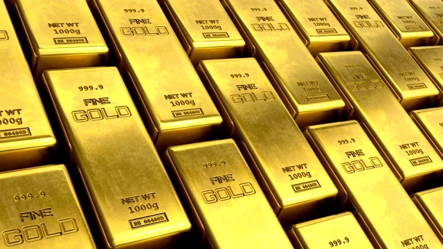近景无限循环移动堆垛金条。成功还是致富的概念。在金条上滑动相机视图的动画