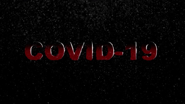 COVID-19、冠状病毒，黑色背景上带有浮动粒子的红色大写动画文本