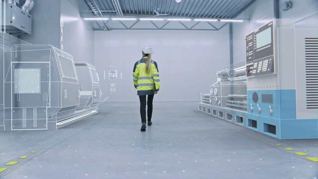 女工程师通过增强现实的工厂车间创建三维模型数控机械生产线。工业4.0图形可视化工厂。VFX特殊视觉效果