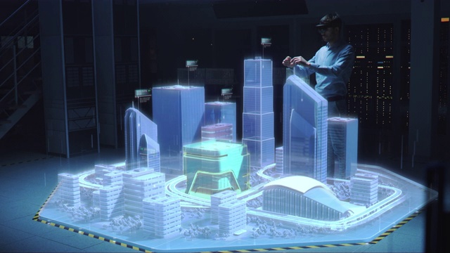 工业4.0:现代专业建筑师戴着虚拟现实耳机使用手势来移动、设计、操纵3D城市的建筑。混合增强现实软件。特效特效