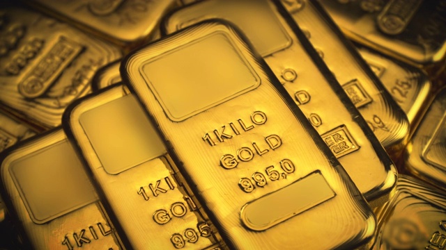 真金条。黄金锭。精细金条堆叠的特写视图。商业和金融成功的概念。财富的概念。金条的原始镜头。