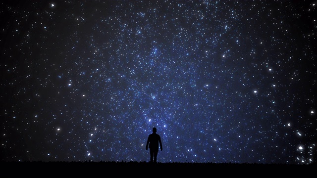 看星星的人。独自一人仰望星空。
