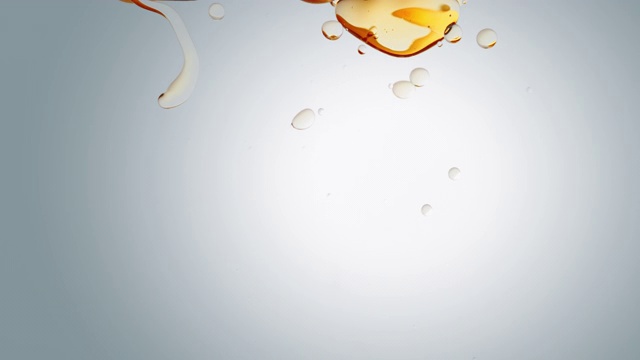 詳情圖-透明的化妝品橙色金色的油泡泡和形狀在白色的背景