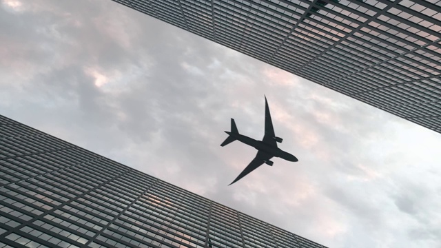 詳情圖-飛機(jī)在美麗的天空下飛過辦公大樓