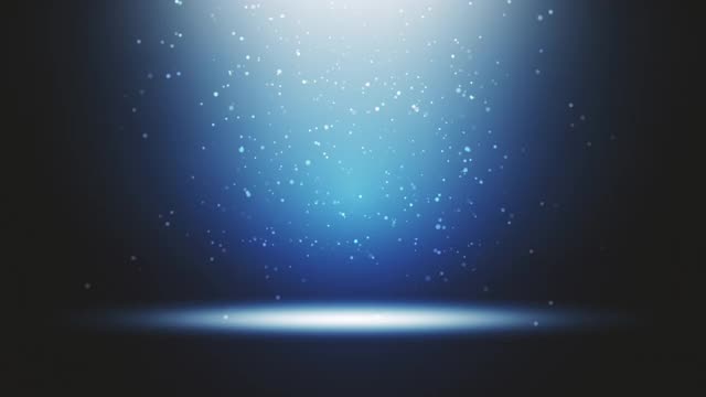 舞台灯光在蓝色演播室闪烁。大聚光灯从空中照亮了这景色。舞台上闪烁着光芒的灯光。所有的灯光都聚集在一个点上。表演艺术，派对，灯光，事件，庆典，UFO，瞬间移动的概念