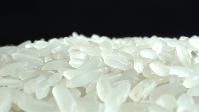 詳情圖-白米粒特寫。堆大米。食品的背景。