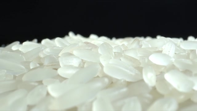 詳情圖-白米粒特寫。堆大米。食品的背景。