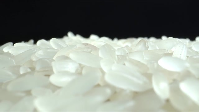 詳情圖-白米粒特寫。堆大米。食品的背景。