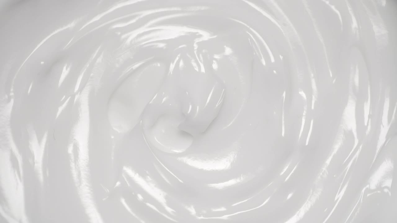 化妆品膏背景。白色化妆品霜，皮肤和身体护理与纹理旋转