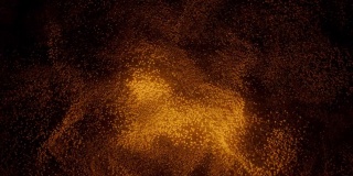 在黑色背景上散布的金色沙子的抽象图案。橙色点云在黑暗中盘旋。虚拟数据。VJ循环运动背景。4K动画- 3D渲染