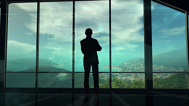 一名男子站在窗口查看物联网信息图元素