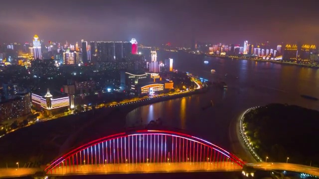 中国夜景时间照亮武汉城市景观青川大桥航拍全景4k时间流逝