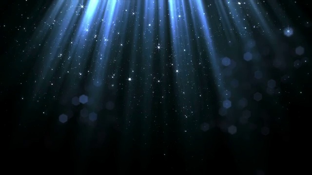 柔和的上光流中平滑下落的粒子和散景