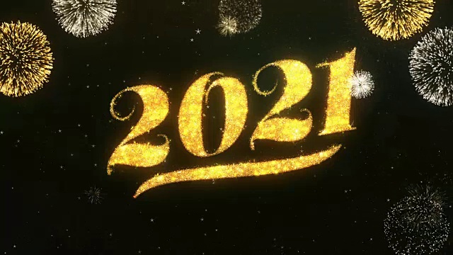 2021年新年祝福和祝福卡由闪光粒子和火花照亮黑暗的夜空与彩色烟花4k背景。