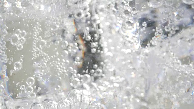 靠近气泡苏打和冰的背景